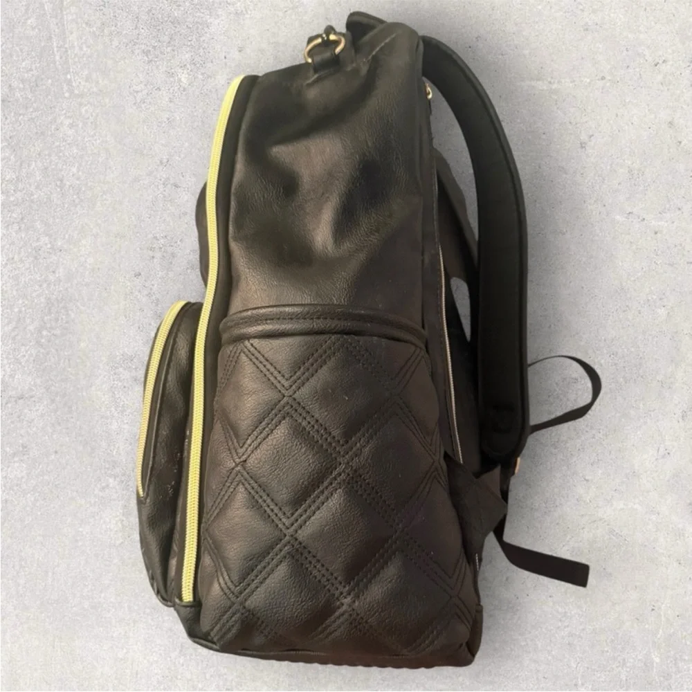 Itzy Ritzy Boss Plus black diaper bag backpack with gold hardware.
